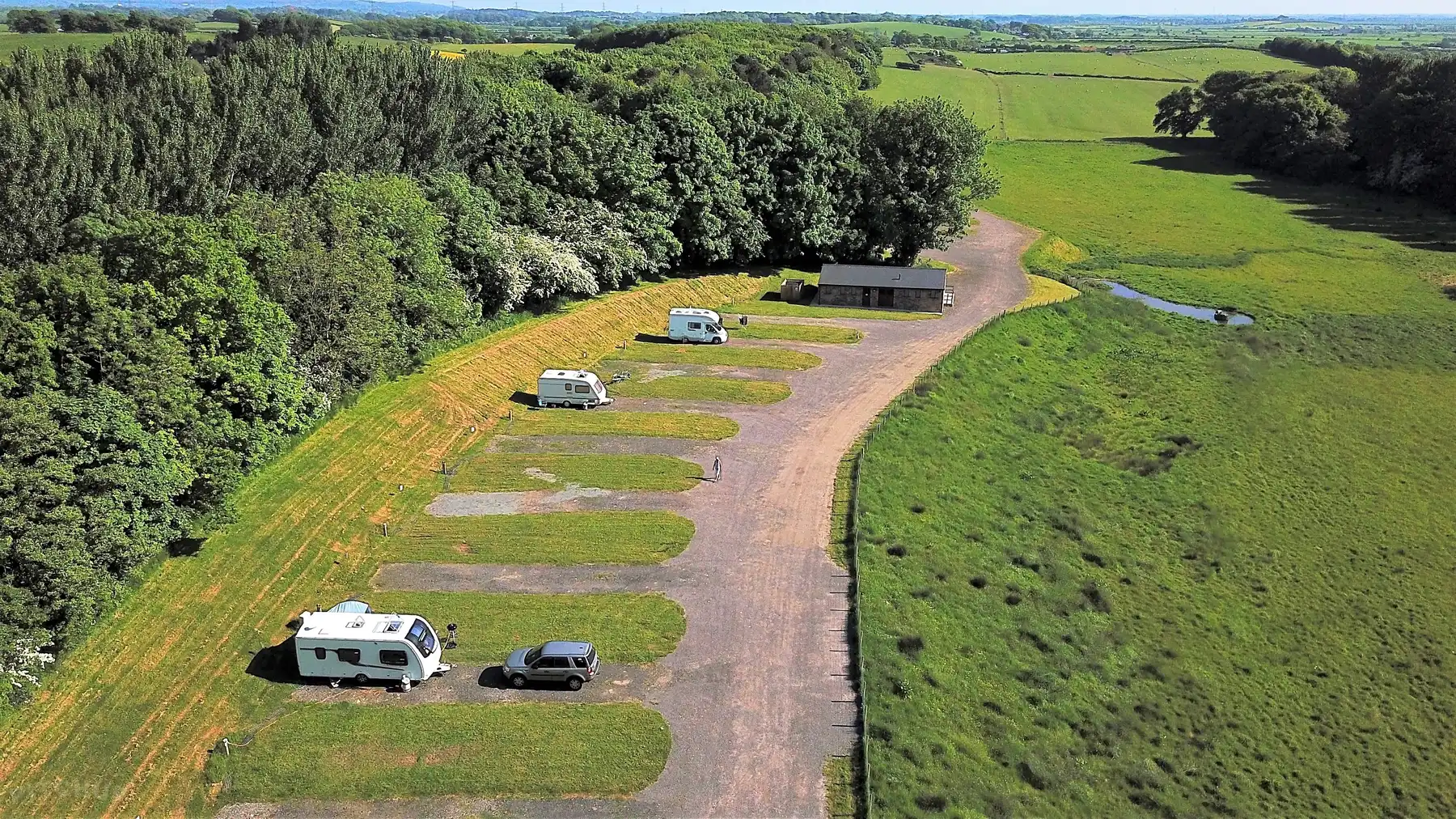Birds eye view of the exclusive Ashton Hall Caravan and camping park, nestled in green countryside with woodland surroundings and abundant wildlife near lancashire