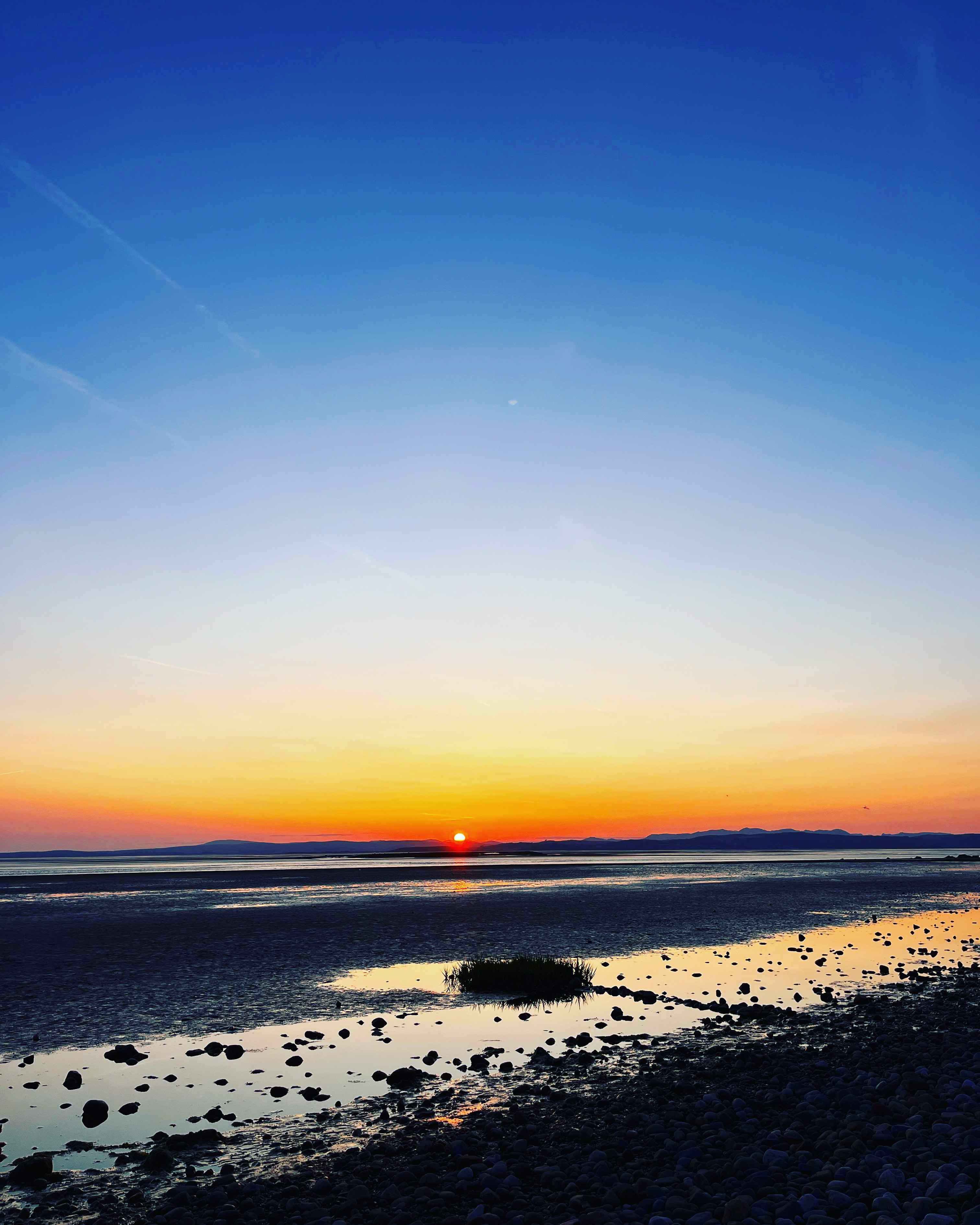 Sunset coastal view within walking distance of Ashton hall caravan park and camping site in Lancashire, perfect for evening strolls by the coast