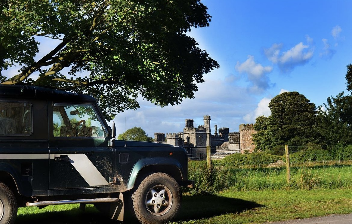 Easy access to Lancaster Castle from Ashton Hall caravan park - Land Rover parked with historic castle in background